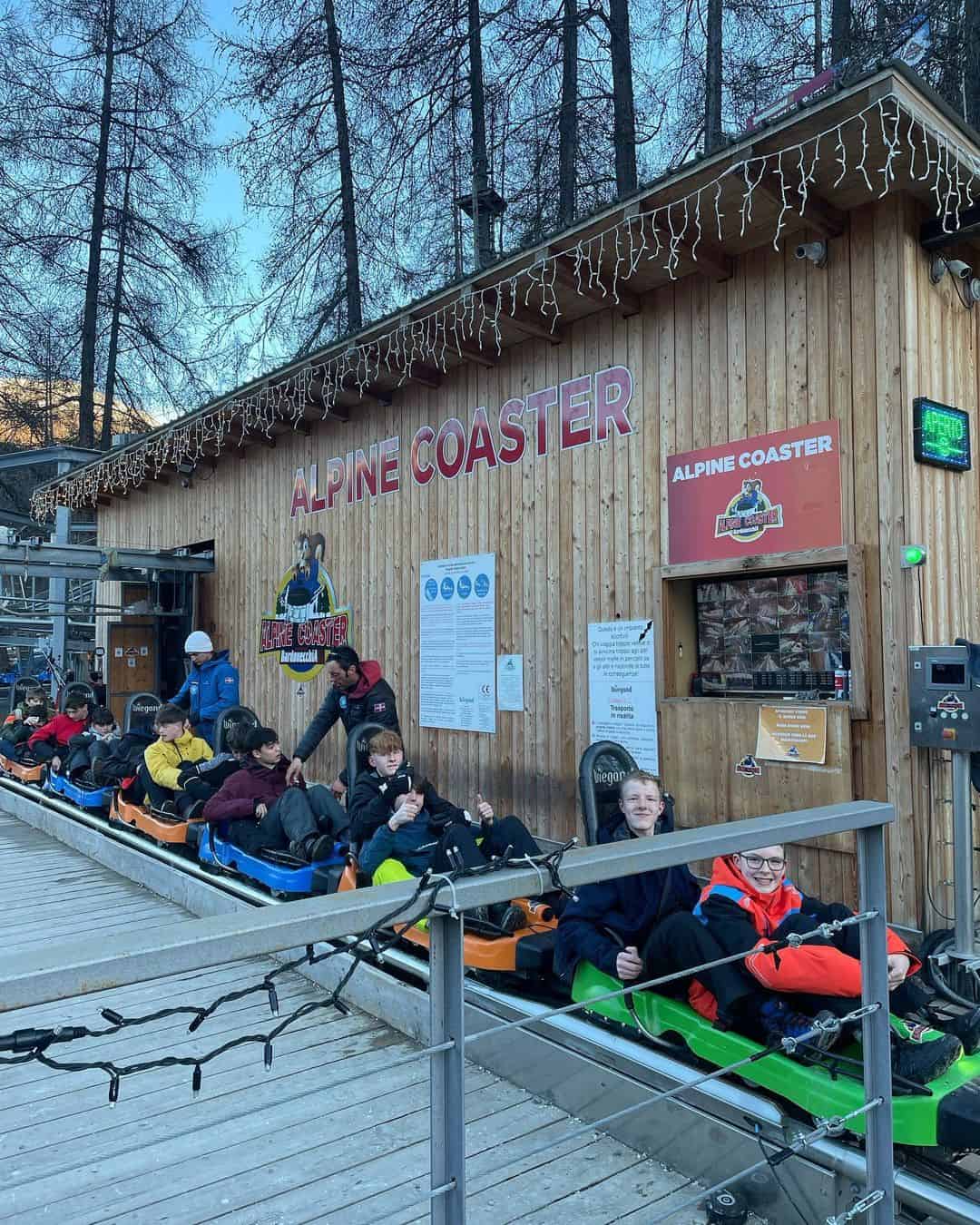 Cheadle Hulme High School students stand sit on the Alpine Coaster in Italy.