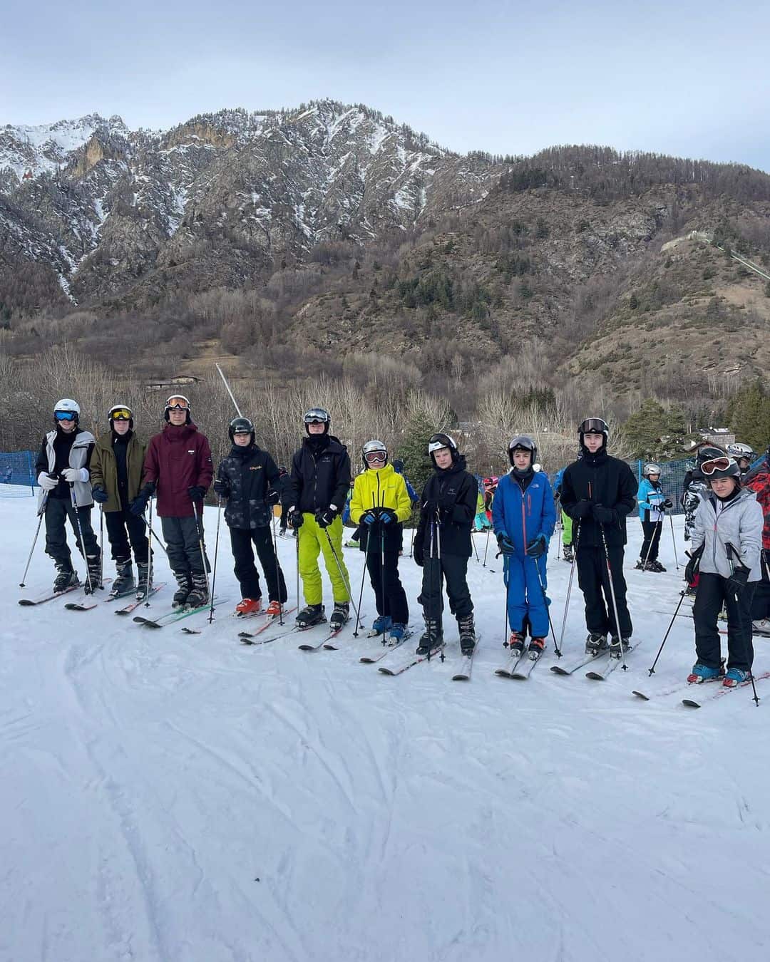 Cheadle Hulme High School students stand in a line on the ski slopes in Italy.