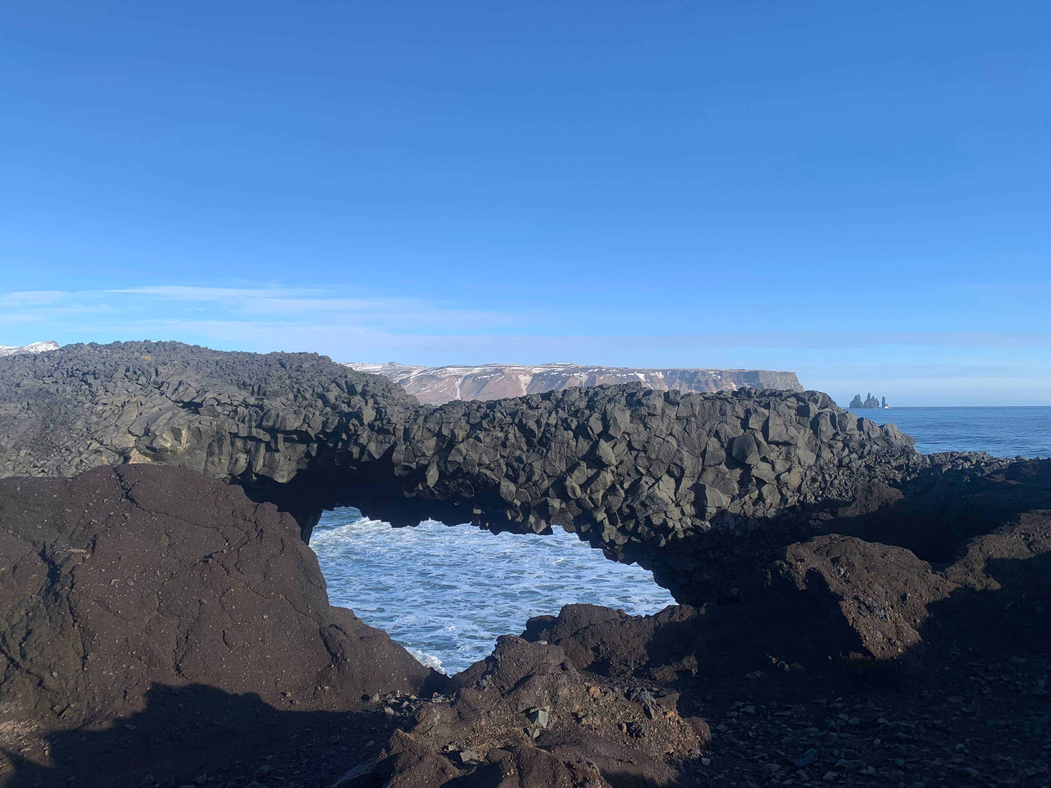 A shot of a unique rock formation forming a bridge in Iceland taken by Abi in Year 12 one of 12 winners in Cheadle Hulme High School Photography Calendar Competition 2024.