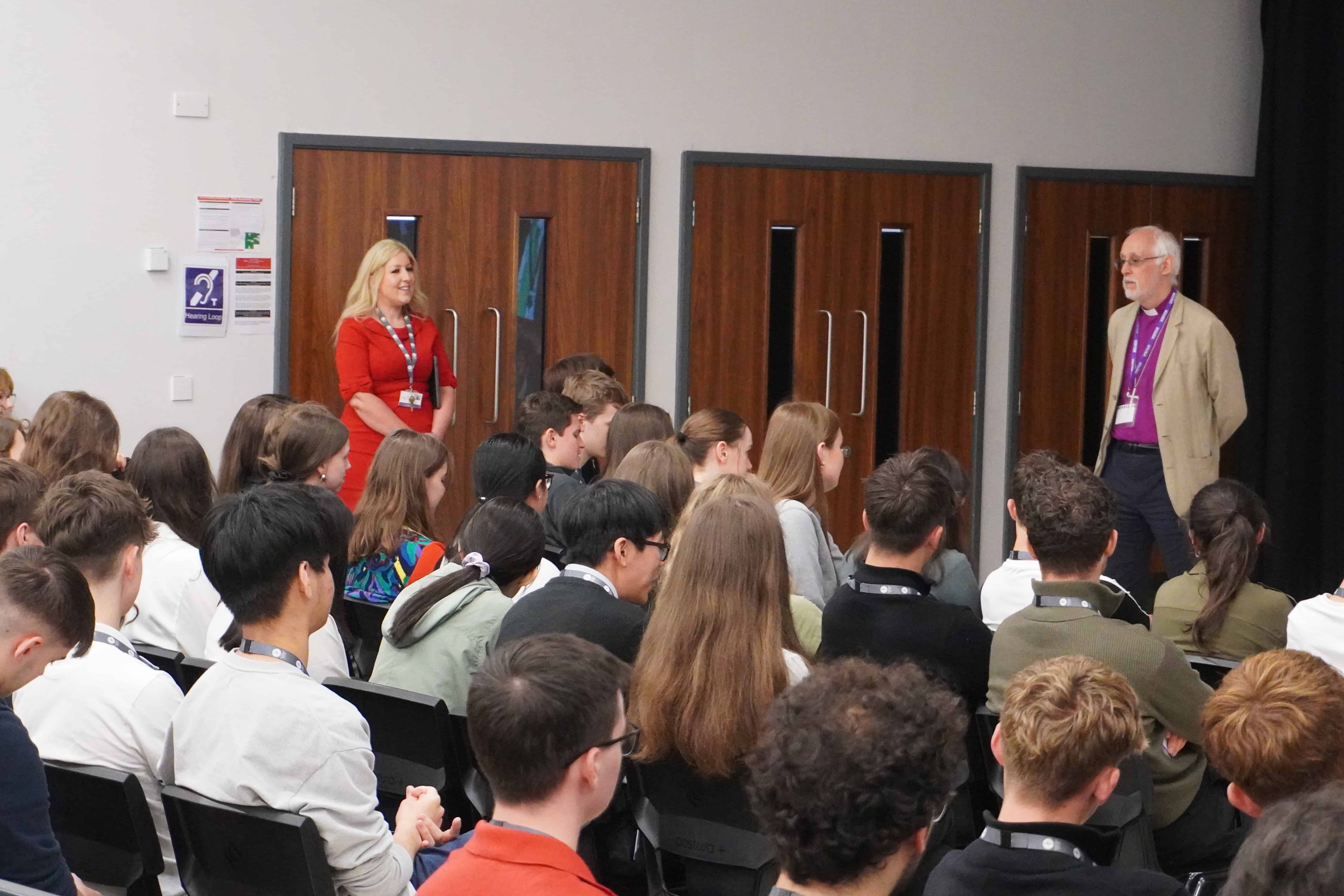 Cheadle Hulme Sixth Form students posing questions to Dr Walker. 