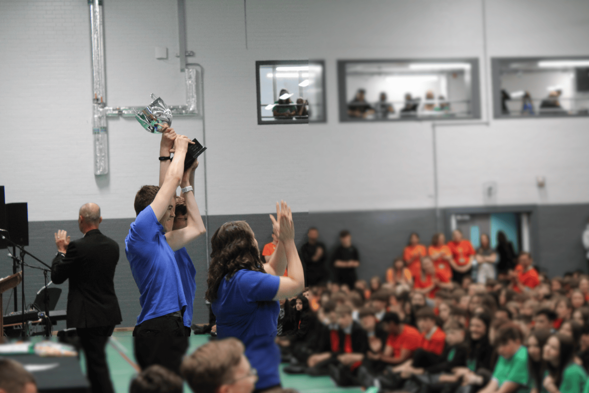 Fortius, the winning House of Cheadle Hulme High School with the most House Points this year, raise the trophy smiling.