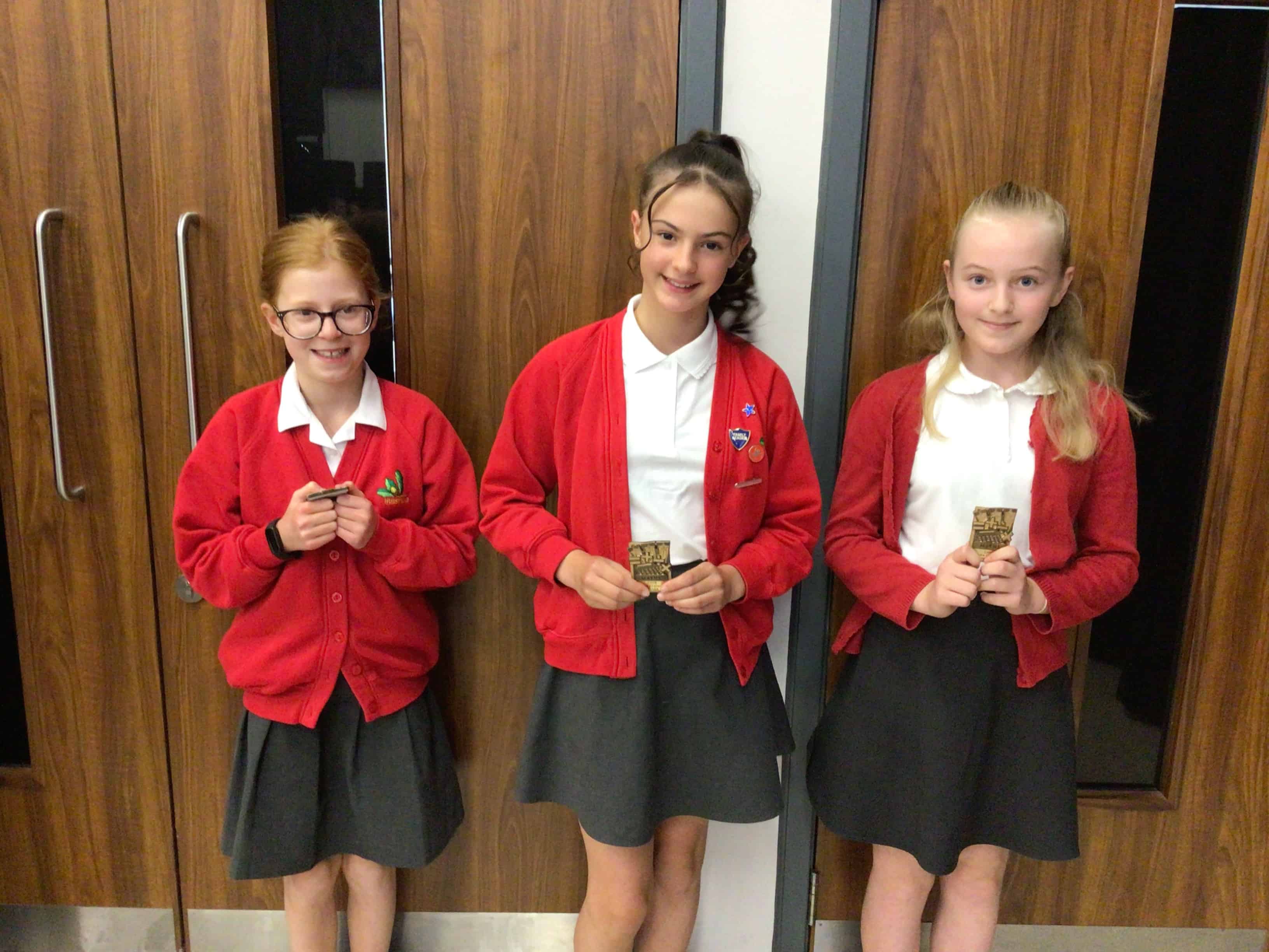 The winning pupils from Hursthead Primary smile with their CHHS Maths Award magnets that they earned at the Cheadle Hulme High School Maths Award Evening.