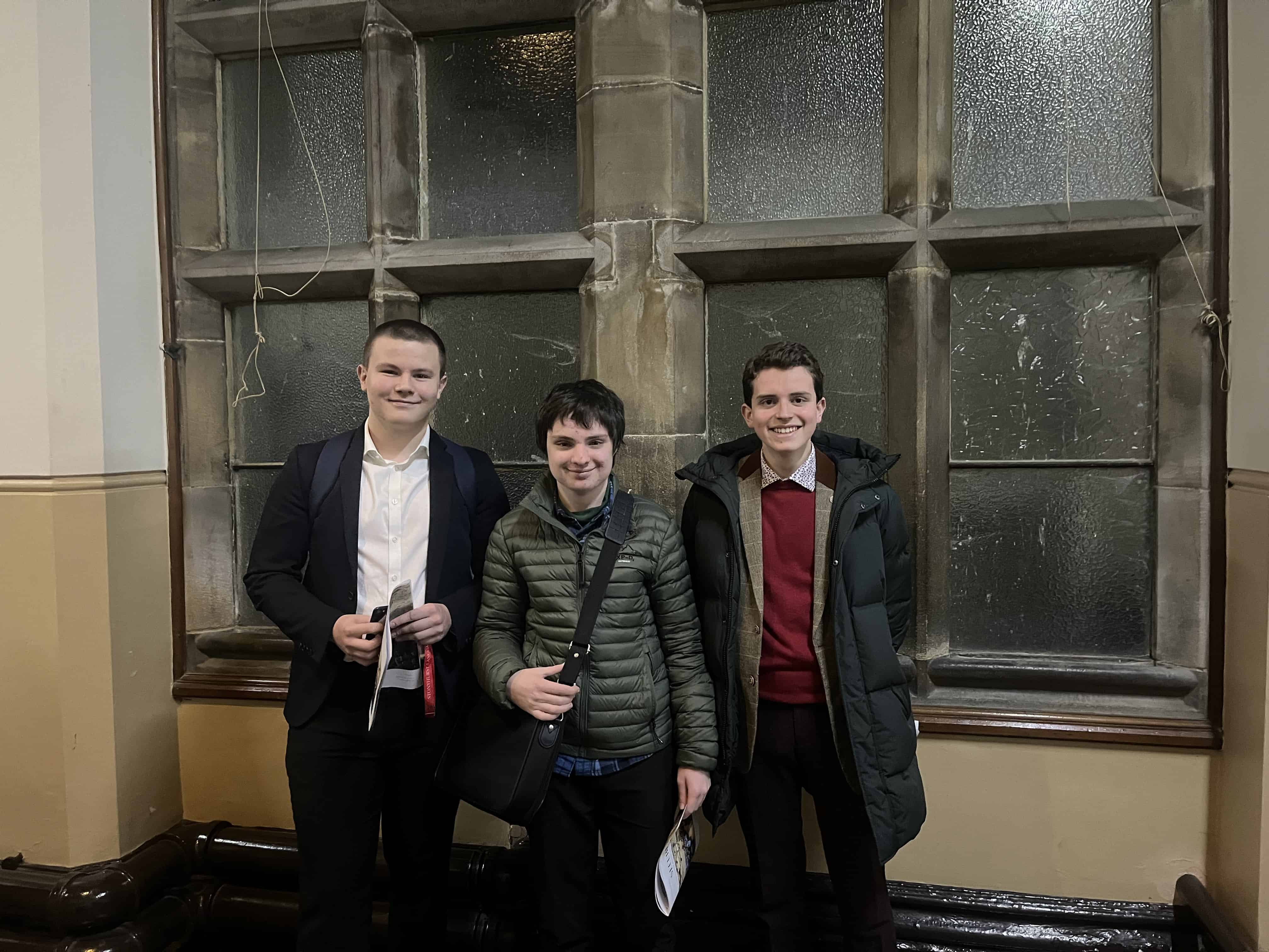 Three students from Cheadle Hulme High School and Sixth Form smile at the Stonyhurst Model United Nations conference 2024.