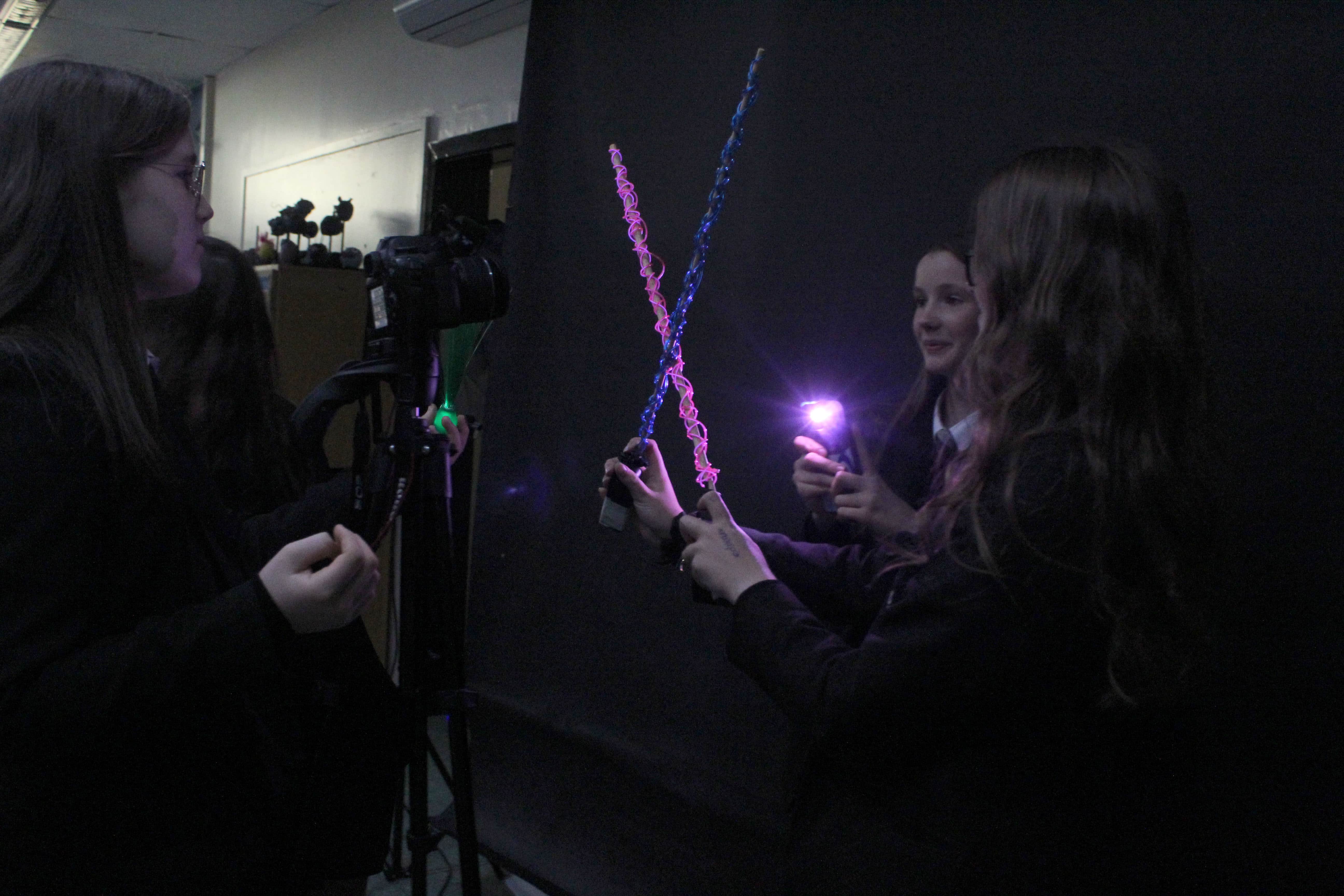 Students from Cheadle Hume High School hold lights and use a DSLR to create their artistic photos in a light painting workshop for the Big Draw 2023.