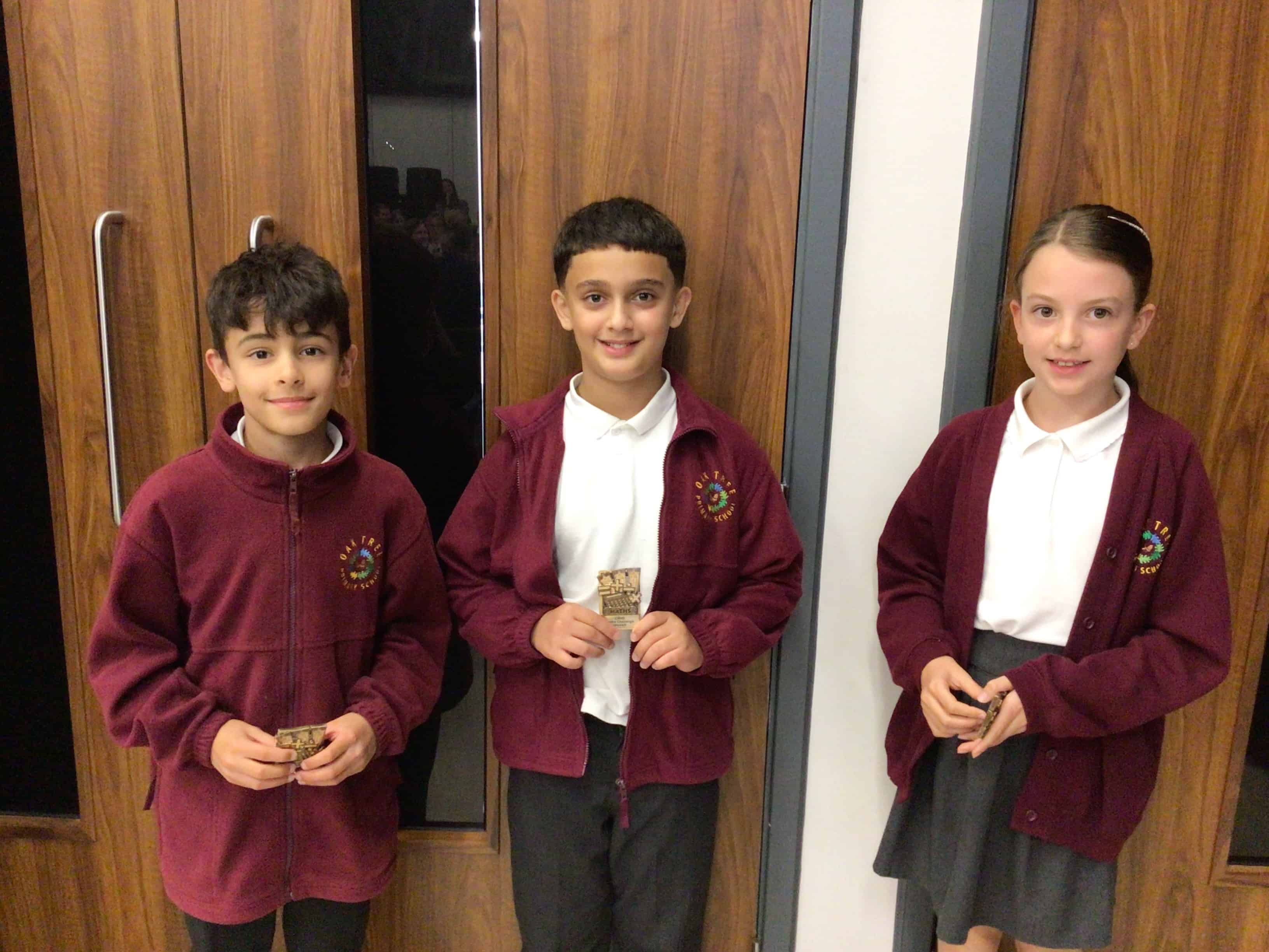 The winning pupils from Oak Tree Primary School smile with their CHHS Maths Award magnets that they earned at the Cheadle Hulme High School Maths Award Evening.